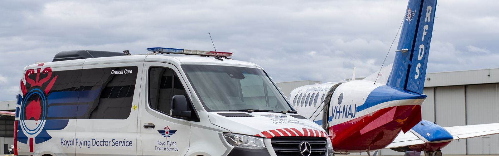 Royal Flying Doctor Service Team in front of their Transport vehicles