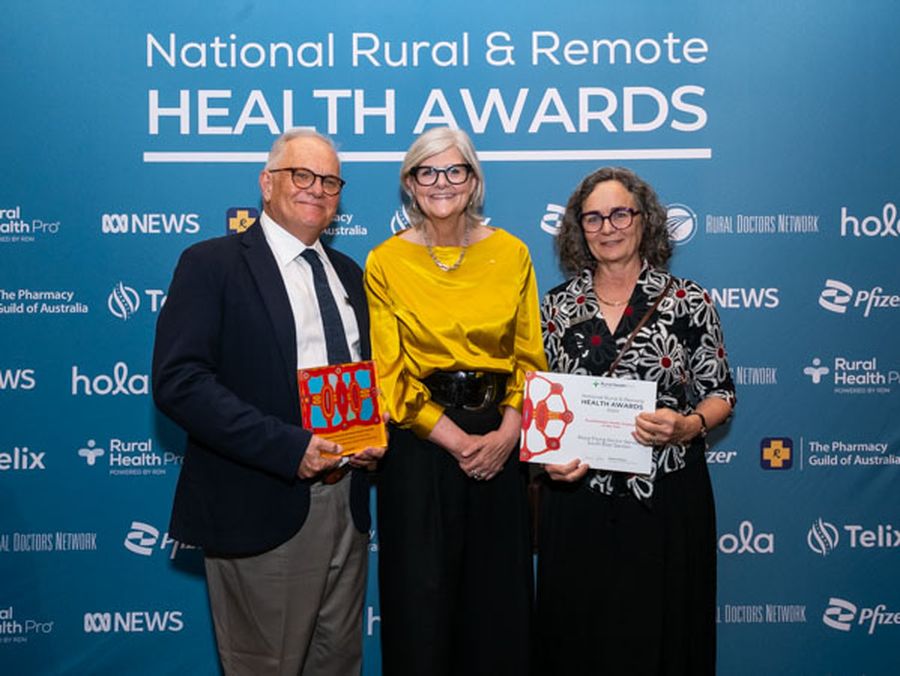 Jenny Beach and Dr Brett Thomson accepting the award