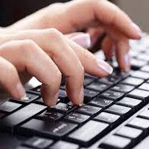 Hands typing on keyboard