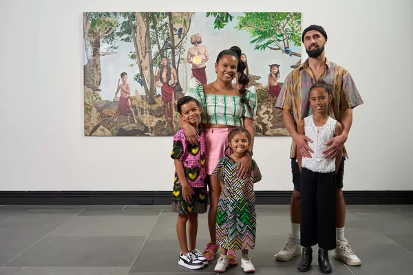 Marikit Santiago and her family  with her work, Sa Simula (In the  Beginning), for the 18th Adelaide  Biennial of Australian Art: Inner  Sanctum, Art Gallery of South Australia, Adelaide, photo: Sam Roberts