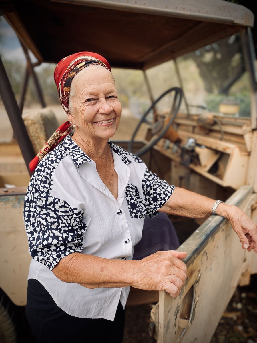 Slyvia standing with her 1954 Series 1 Land Rover