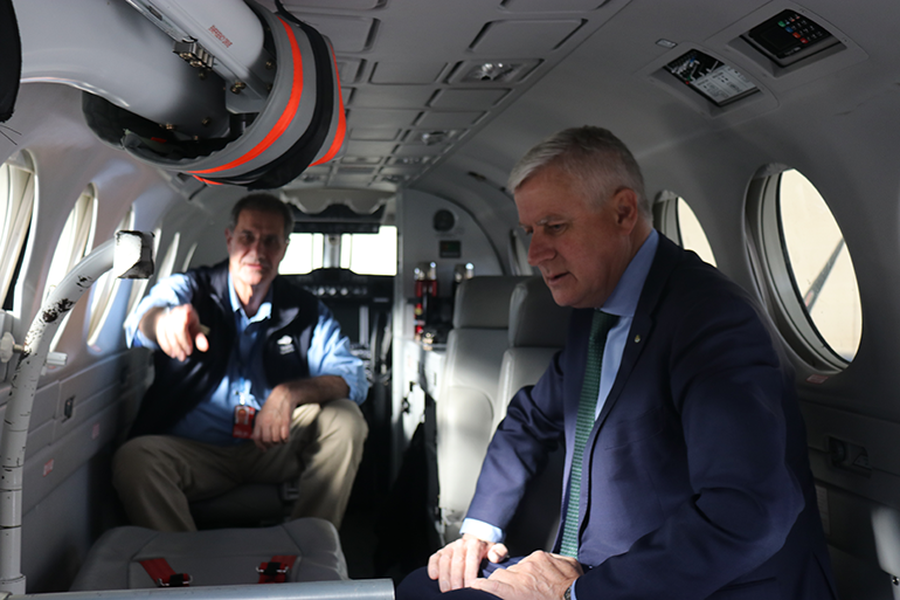 Randall Greenberg and Minister Coulton on Clinic plane