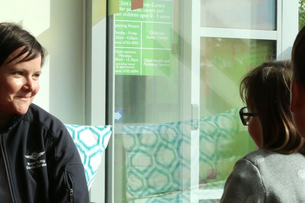 A RFDS TAS mental health clinician talks with children