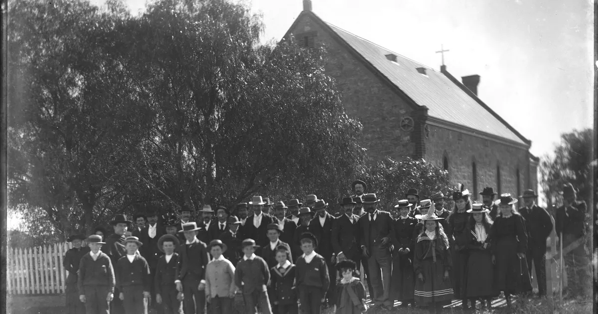 Congregation gathered at gate of church - AGSA Collection