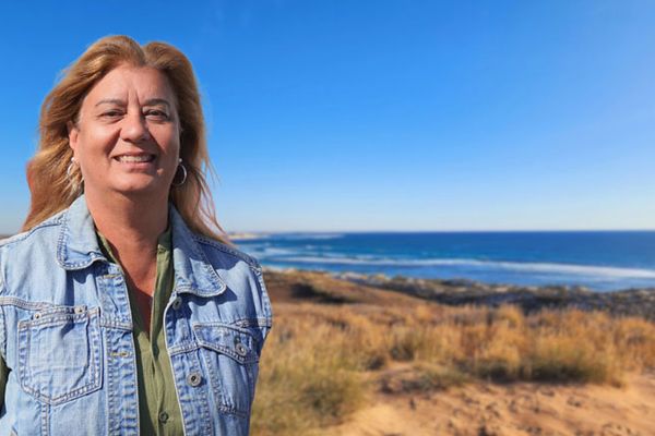 Carol smiling at the beach.
