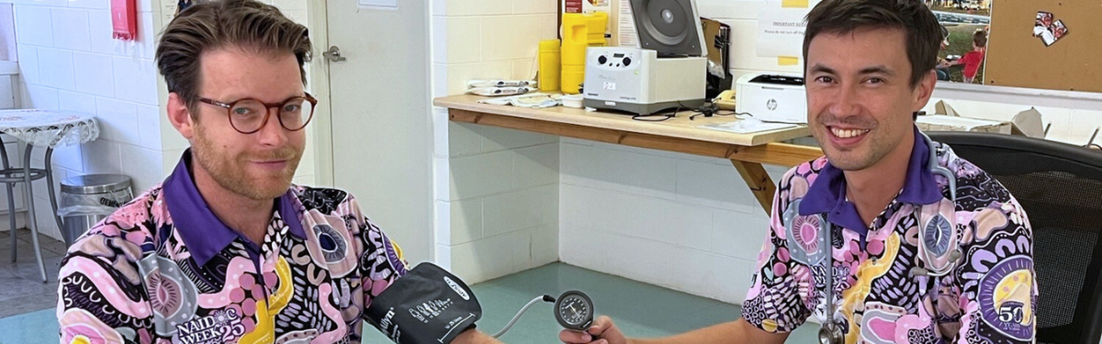 Dr Nick checking nurse blood pressure