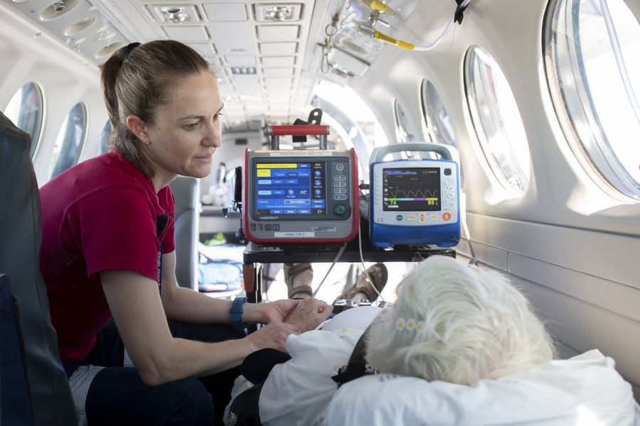Photo of Flight Nurse Jacinta beside an RFDS aircraft