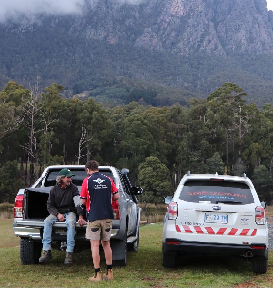 RFDS primary health care worker with patient in the back of the ute.