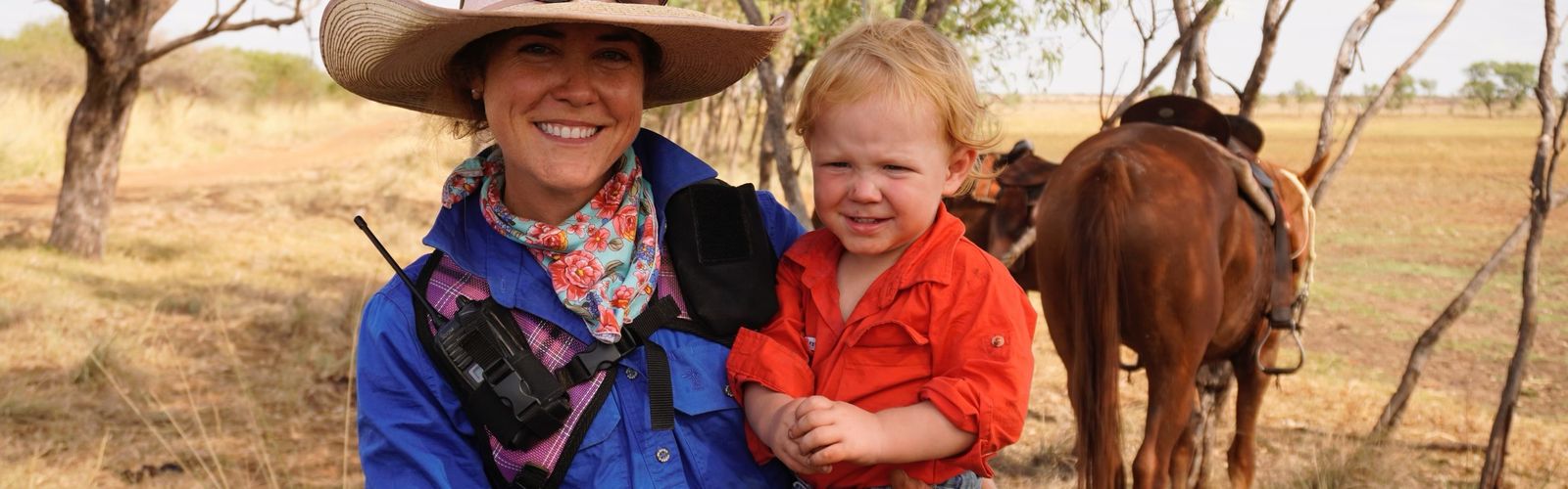 Camille and her young son Lachlan on an outback muster