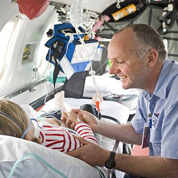 RFDS Dr checking a child is ready to fly on an rfds aeromedical flight