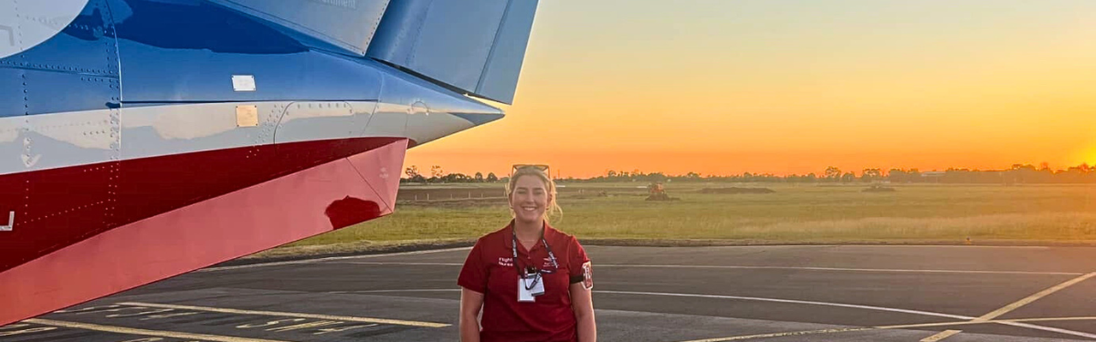Abi in front of aircraft