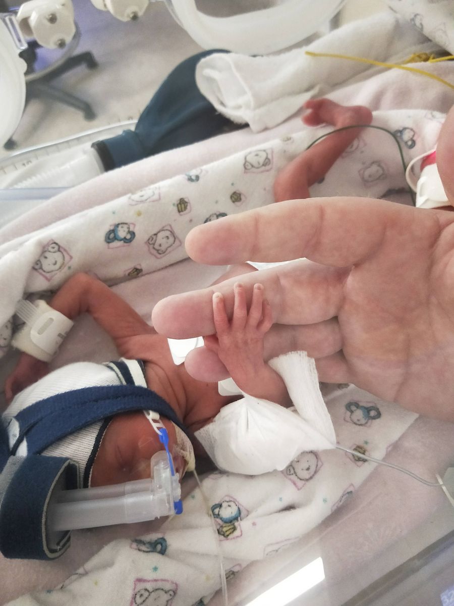 Ella touching dad for first time