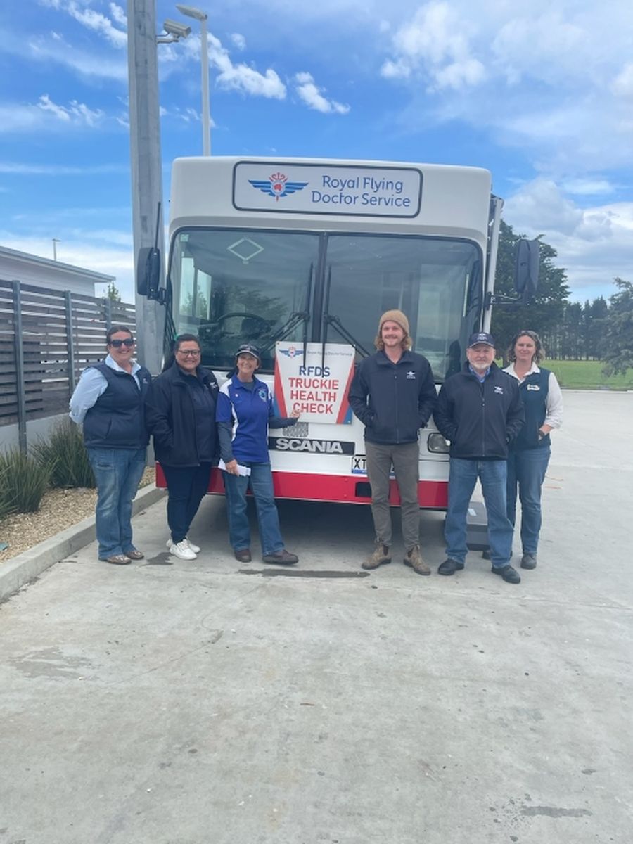 The RFDS team in front of the health hub bus.