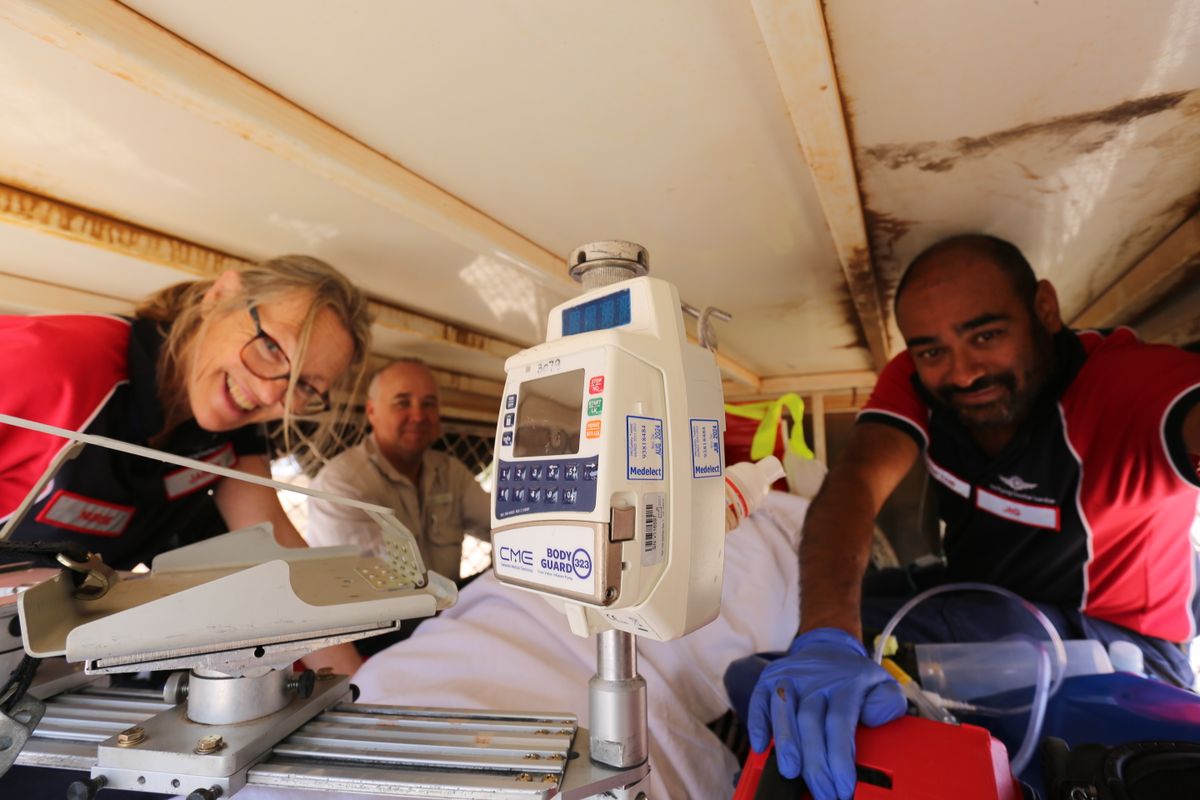 Dr Jig and Nurse Janice smiling in the back of a ute.