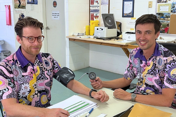 Dr Nick checking nurse blood pressure 