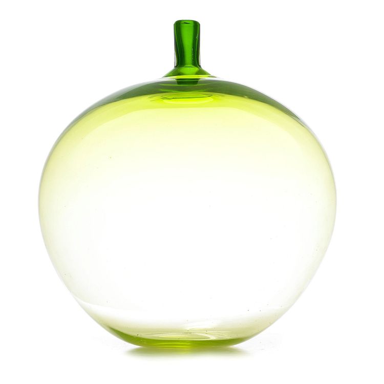 Photo of a transparent green glass apple.