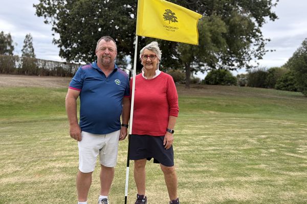 Club captain Craig Richards and member Mandy Burbury on course at Longford.