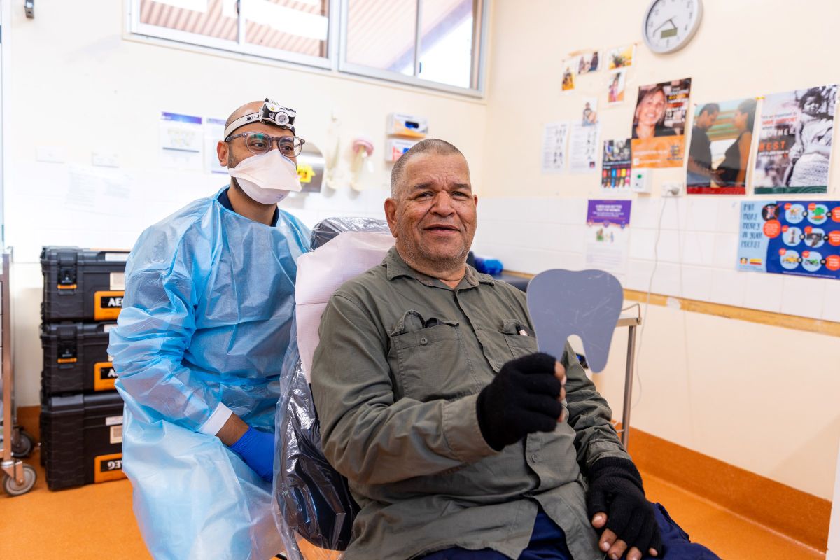 RFDS Senior Dentist Dr Vaibhav Garg with patient Leroy Lester