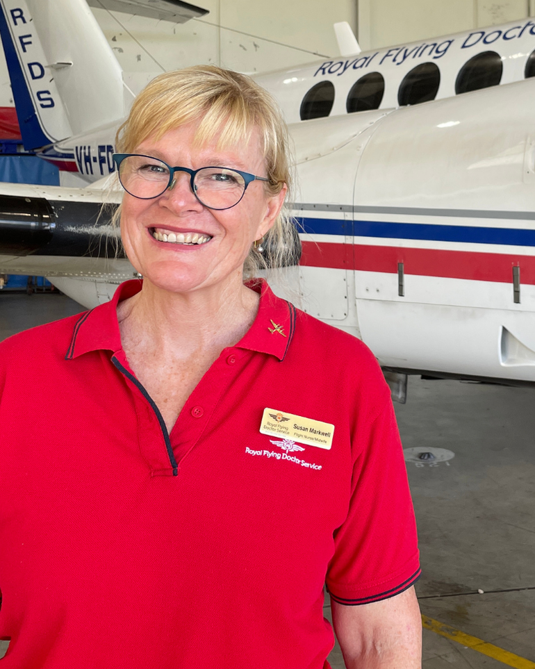 Susan Markwell with an RFDS Aircraft