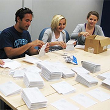 volunteers stuffing envelopes