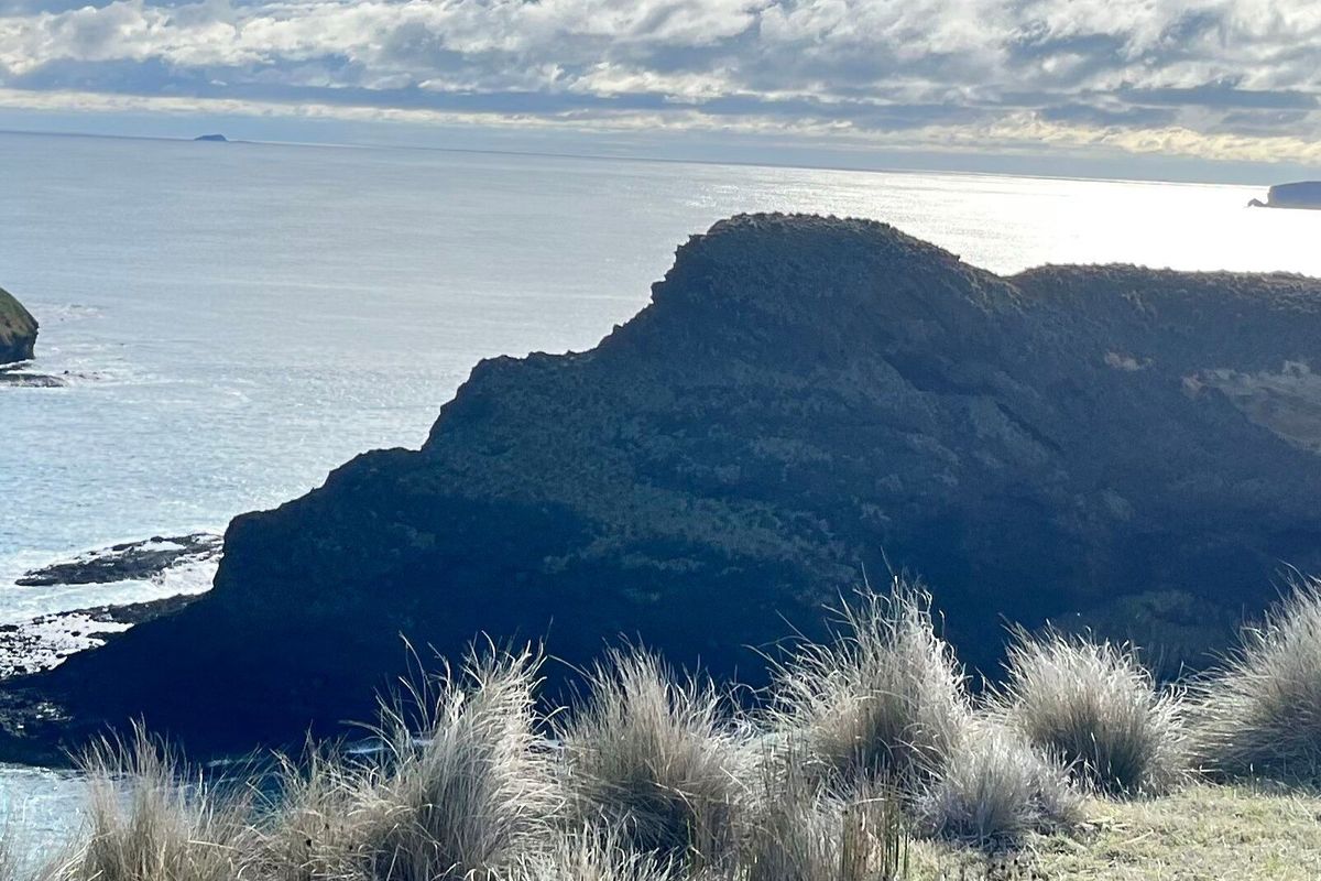RFDS Tasmania health worker on Tasmanian cliff.