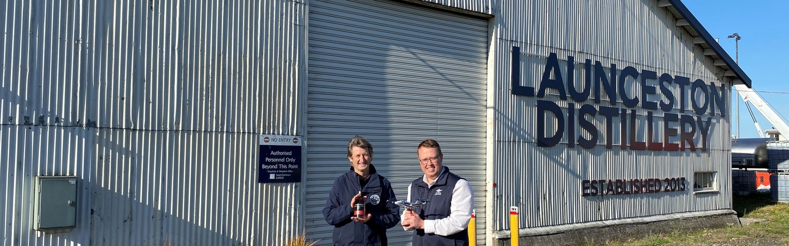 RFDS Tasmania's Corey Martin with Chris Condon of the Launceston Distillery