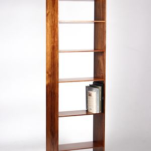 A wooden bookshelf with a few books on it
