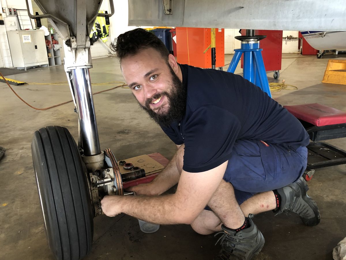 Sam in first year of apprentice near plane