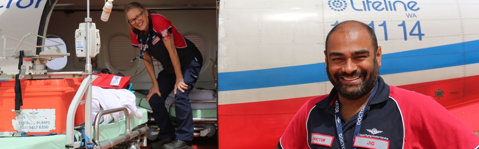 Dr Jig smiling in front of a PC-12.