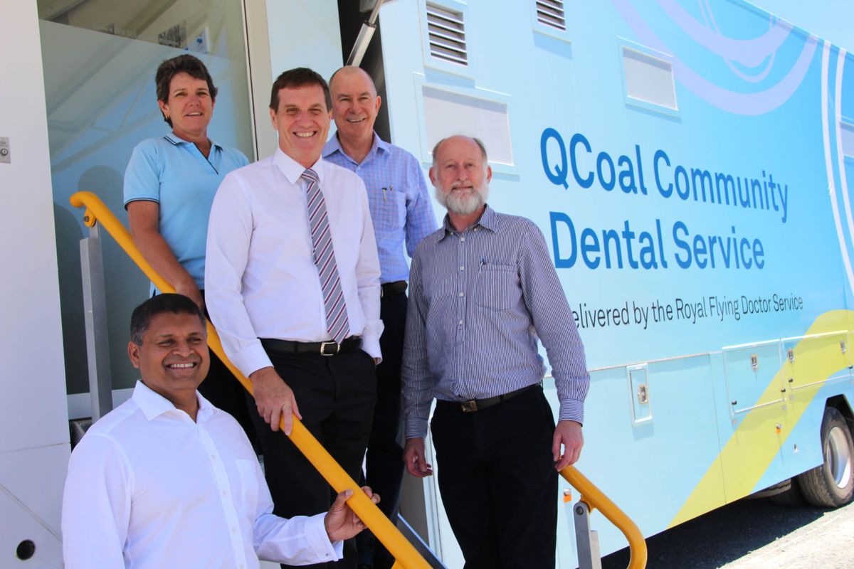 People Stand on step of RFDS dental Van