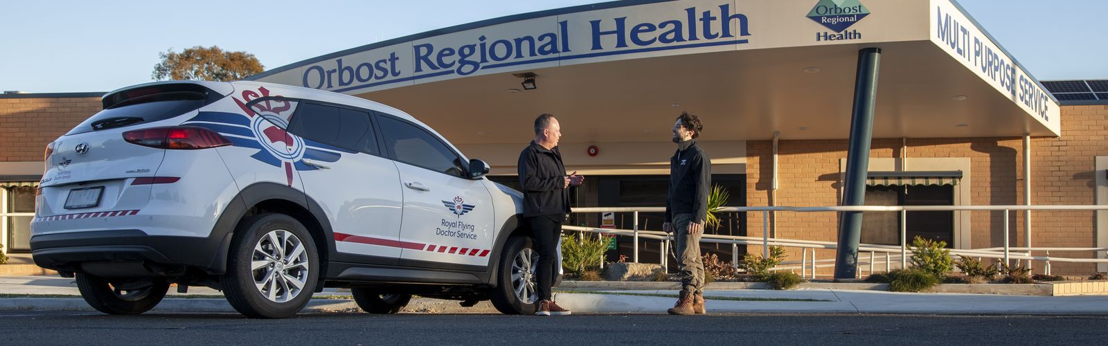 An RFDS car driving along a road in Gippsland