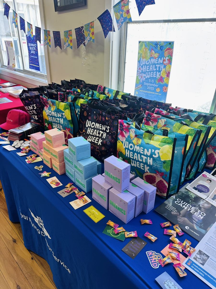 Table laden with Women's Health Week resources 