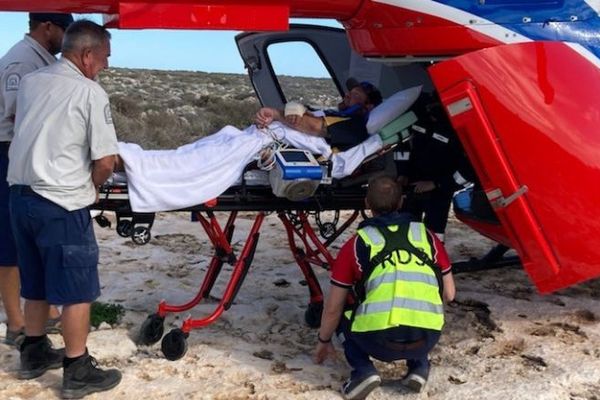 Justin being loaded onto the Heli