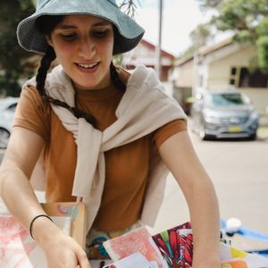 A Sydney Craft Week participant with a local market stall selling handprinted teatowels