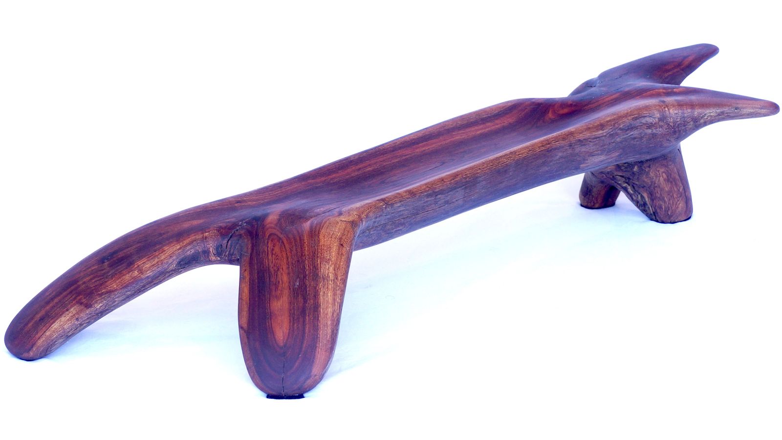 A long low wooden piece with rounded edges on a white background