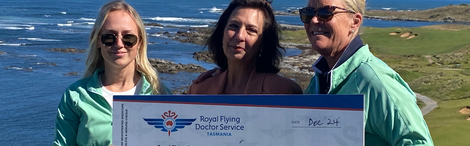 Caroline Wells, RFDS Tasmania Board Chair accepts cheque from Ocean Dunes Manager Amanda Jones