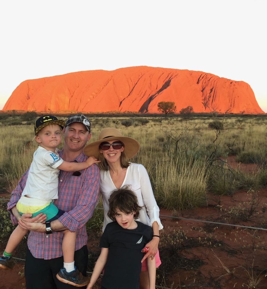 Sophie and Ash, pictured at Uluru wiht their sons Ownen and Harvey, five months before Ash's death