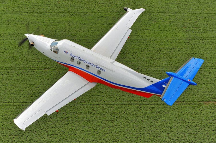 RFDS aircraft flying over paddock
