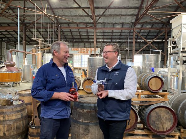 RFDS Tasmania's Corey Martin with Chris Condon of the Launceston Distillery