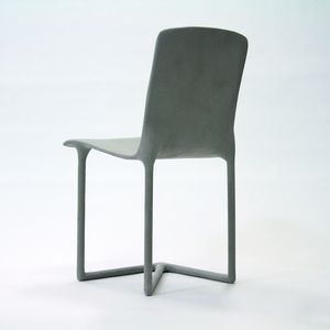 A grey kitchen chair with three legs on a white background