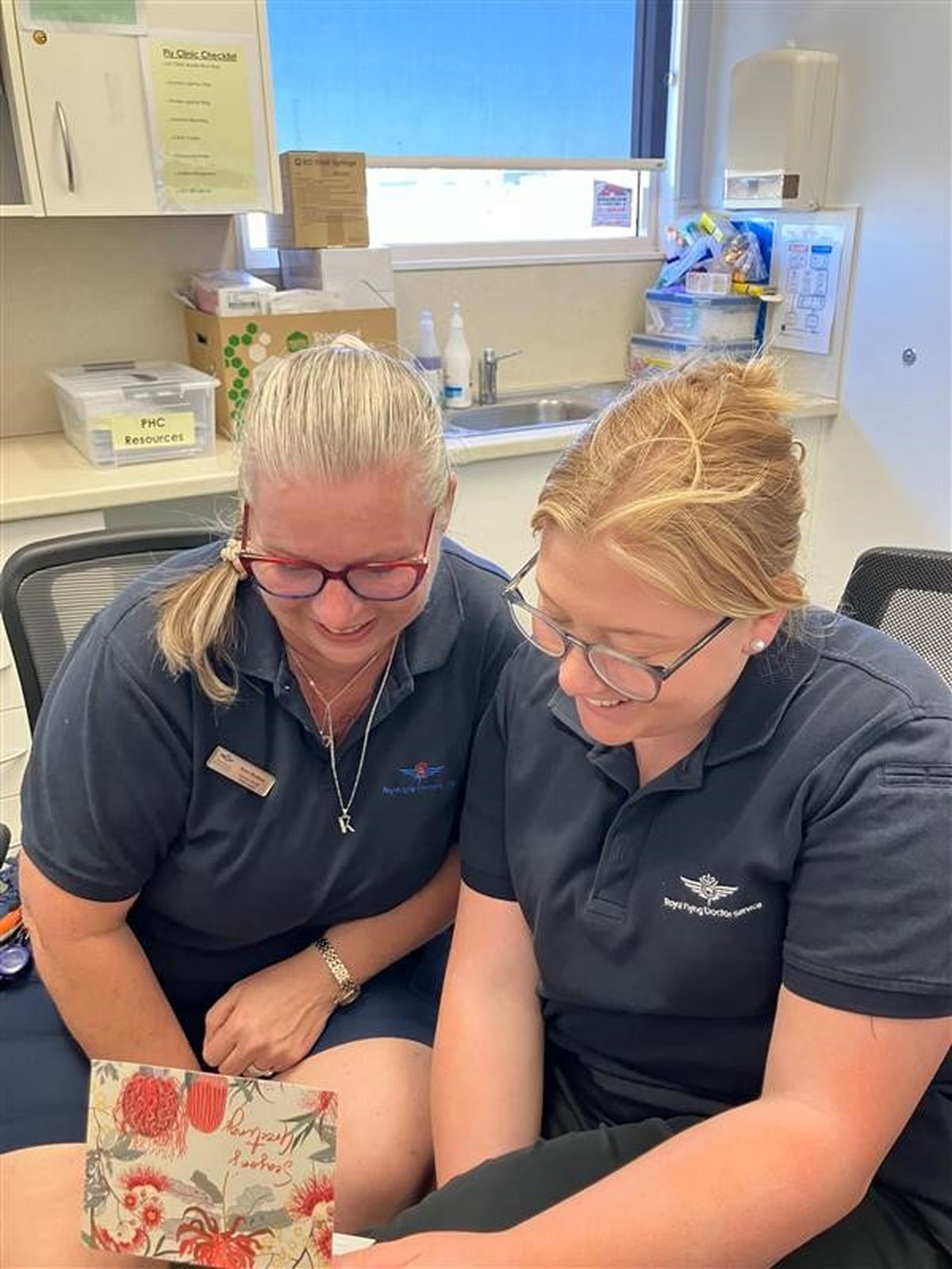 Kerri Rothery (left) - Team Leader – Primary Health and Abbey Barrett (right) - Primary Health Nurse receiving Christmas card