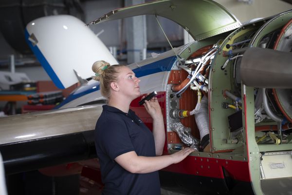 Cate working in the hangar