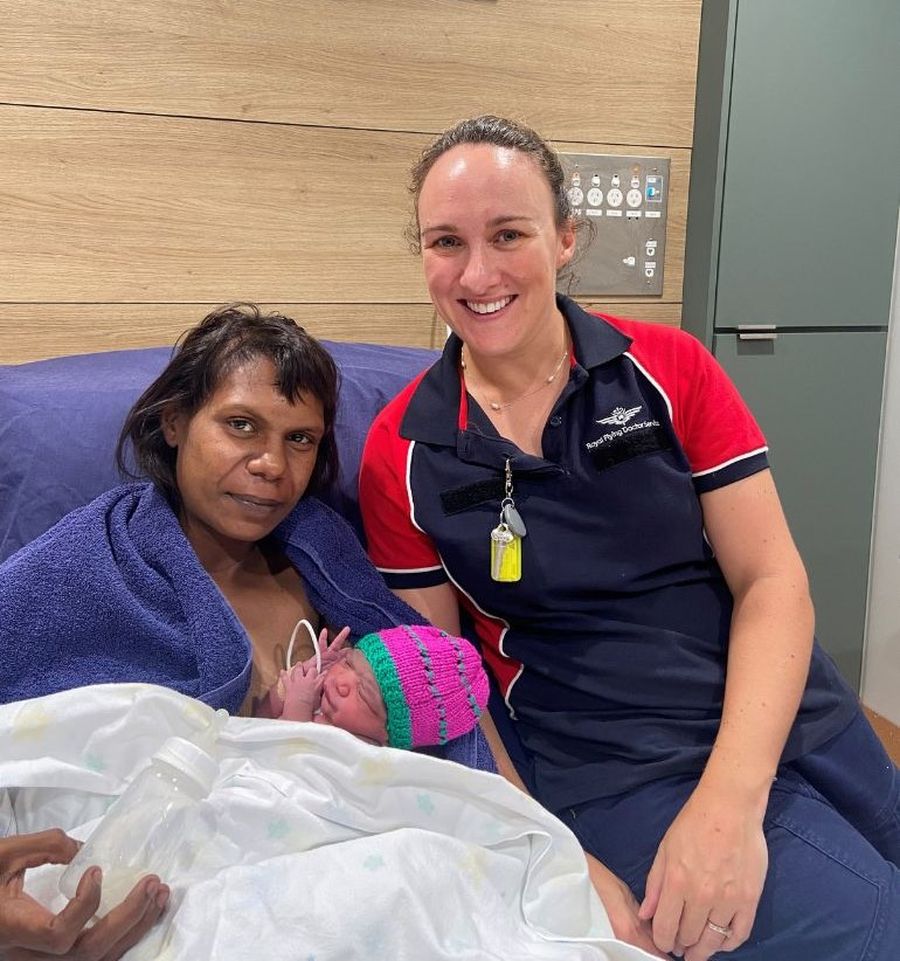 Mum Shaina holding baby Louisianna with Nurse Jade