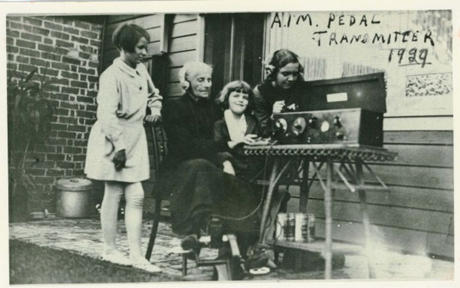 1929 pedal radio with a lady and children sending a morse message.