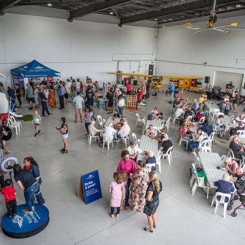 People at the RFDS Roma base having a picnic on the grass