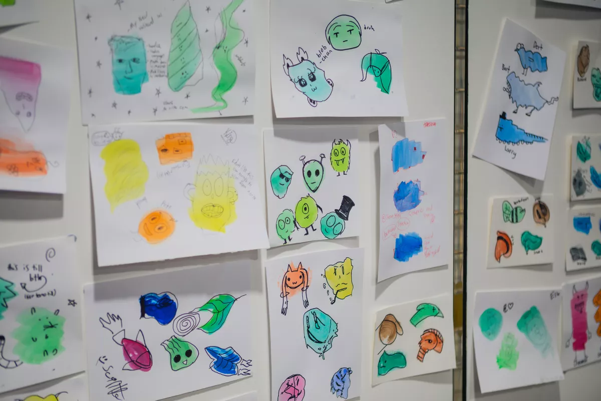 Display of Neo Ambassador activity 'Blob Monsters' stuck up on wall.