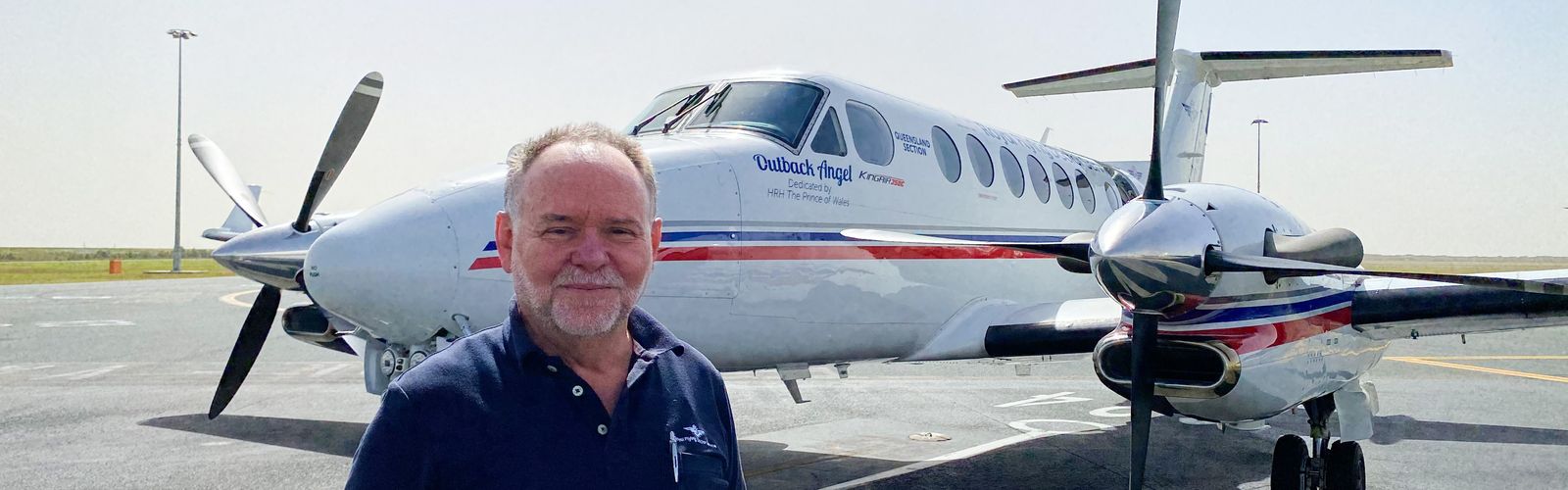 Captain James Williams in front of an RFDS Aircraft