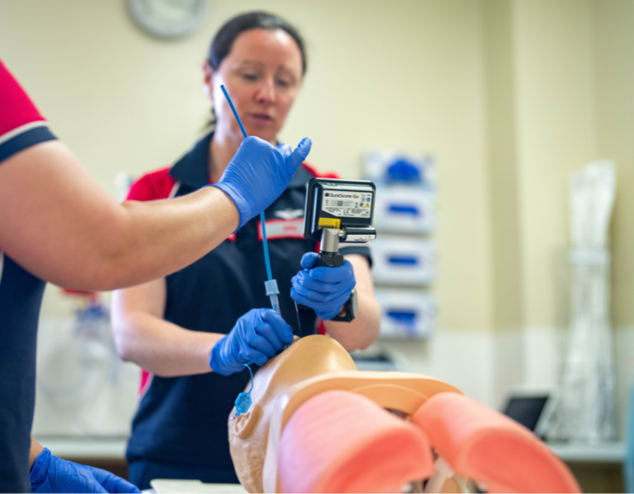 Dr Deb practising on medical equipment