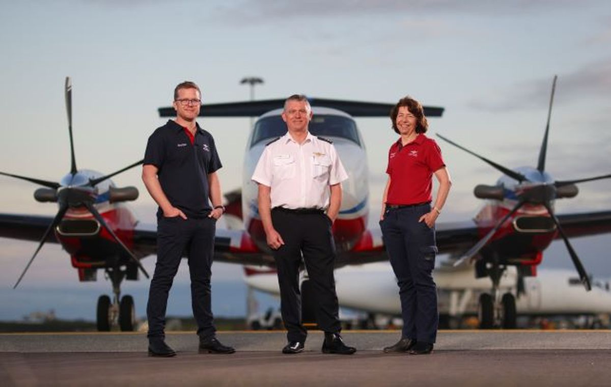 Doctor, Pilot, Nurse stand in front of the B360 aircraft
