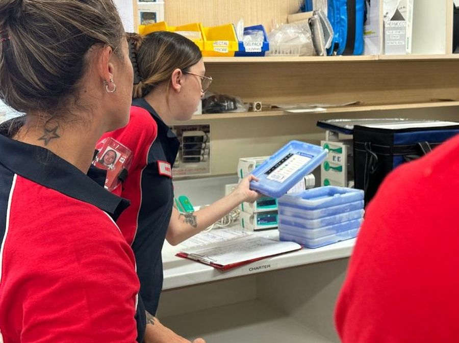 Zoe inspecting clinical equipment.